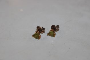 A pair of 9ct gold heart shaped peridot set ear-ri