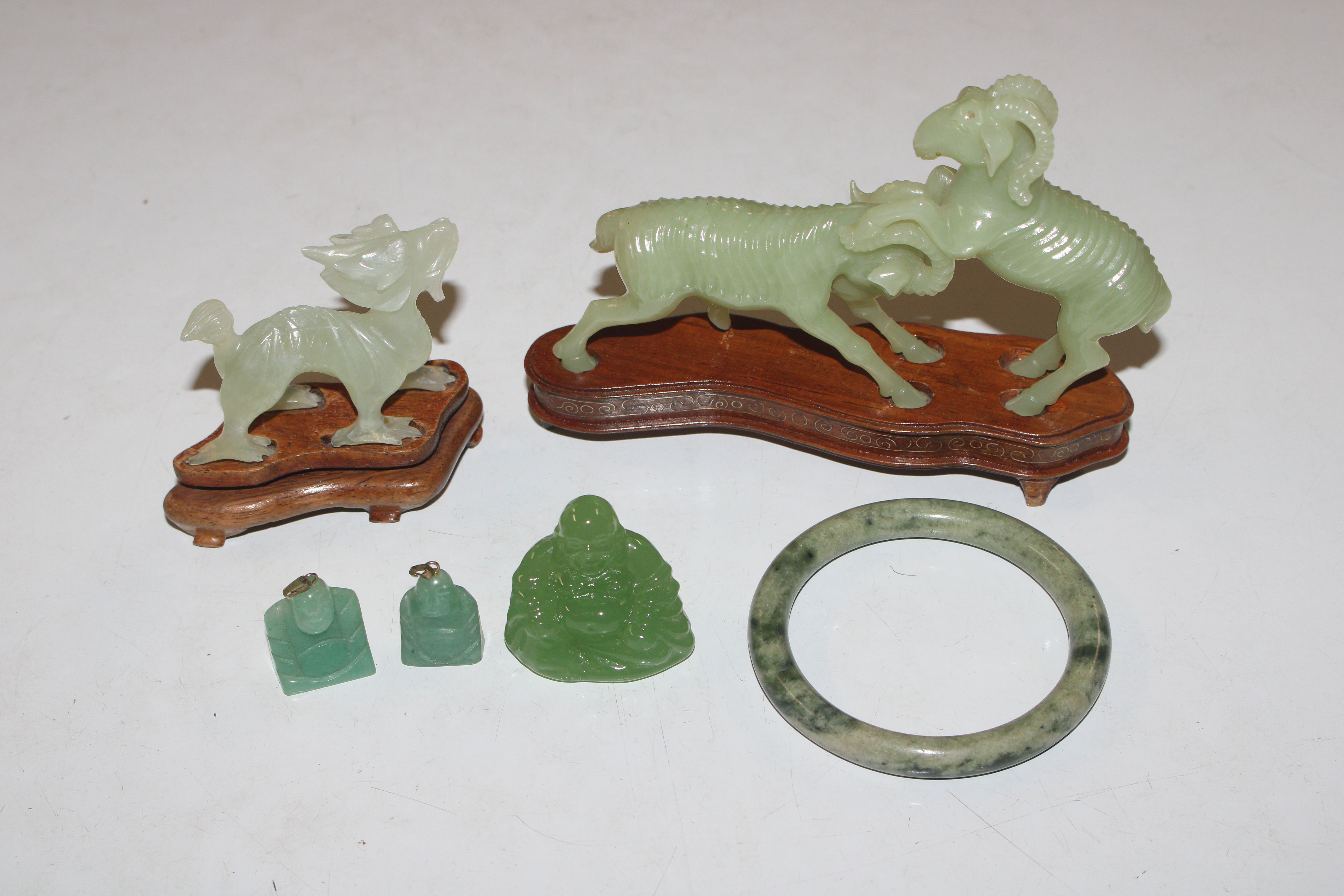 A box of jade coloured ornaments to include dragon