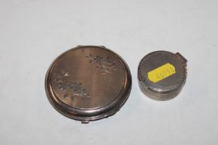 A silver engine turned pill box, approx. 23gms and
