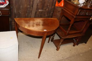 A 19th Century demi lune hall table raised on squa