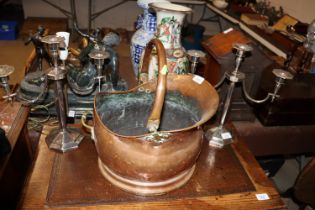 A copper coal scuttle