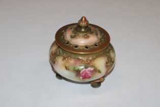 A Royal Worcester floral decorated pot and cover