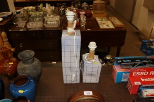 A pair of pottery table lamps, both signed to base