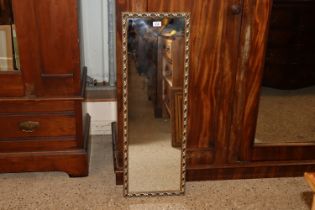 A gilt framed wall mirror