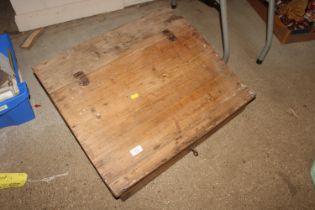 A stripped pine sloping desk top
