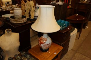 An Oriental decorated table lamp and shade