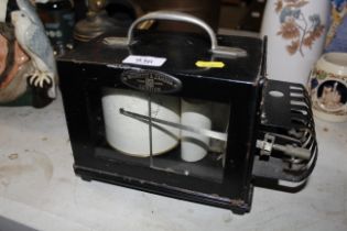 A barograph in painted metal case by Negretti & Za