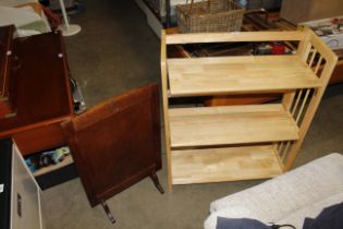 A modern light wood folding bookcase