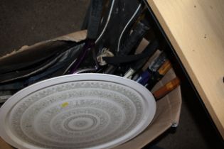 A box containing various tennis racquets and a lar