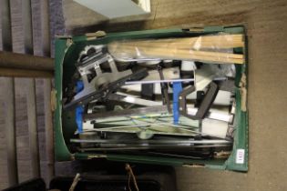 A box containing a mitre saw and various attachmen