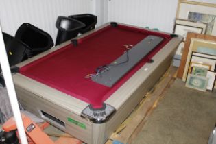 A Supreme pool table complete with overhead light