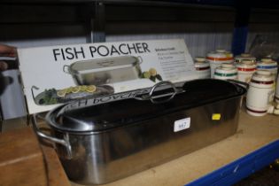 A Kitchen Craft stainless steel fish poacher with