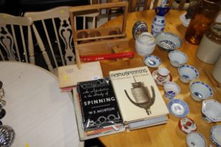 Various books on wool spinning and accessories