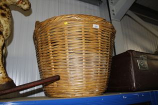 A wicker log basket and a wicker shopping bag