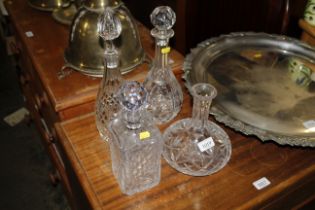 Four various decanters, one lacking stopper