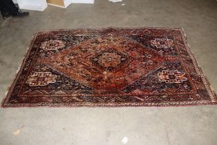 An approx. 8'4" x 5'2" Eastern patterned rug AF