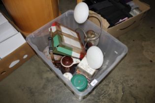 A box containing light fittings and kitchen items