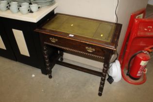 A small oak writing table fitted single drawer