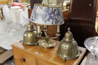 Two Eastern brass hanging lamps and a brass three