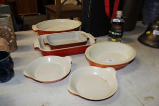 A quantity of Le Creuset dishes
