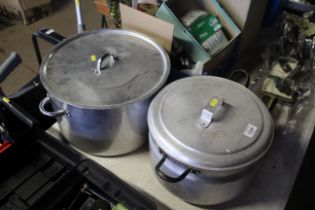 Two large metal cooking pots