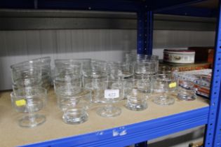 A collection of various glass sundae dishes, desse