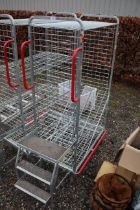 An aluminium cage with wheels