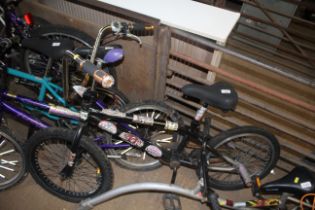 A child's BMX bicycle with chopper style handle ba
