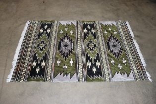 An approx. 6'6" x 4'2" patterned wool rug