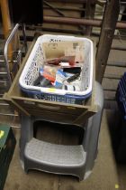 A plastic two tier step; a wooden trug basket and