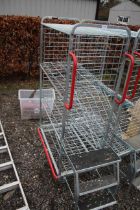 An aluminium cage with wheels