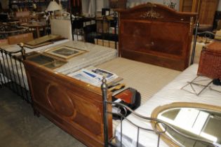 A French walnut and gilt metal mounted bed