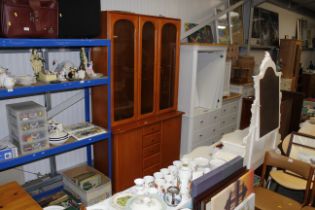 A modern bookcase fitted five drawers and cupboard