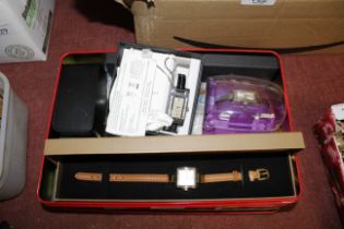 A box containing various watches