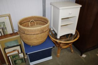 A bamboo and wicker circular glass topped occasion