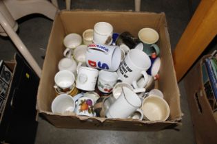 A box of miscellaneous china mugs etc
