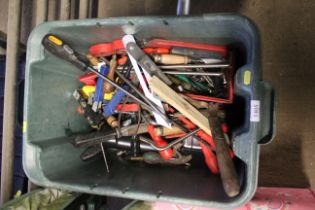 A box containing mixed hand tools