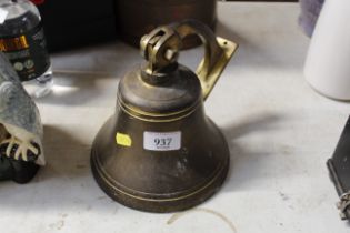 A brass wall mounting bell