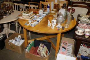 A modern pine dropleaf kitchen table and a set of