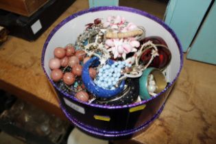 A circular box and contents of various costume jew