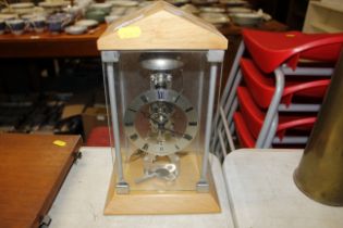 A skeleton type mantel clock in case
