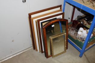 Two wall mirrors and a collection of various print