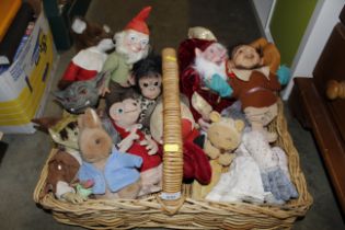 A wicker basket and contents of various soft toys