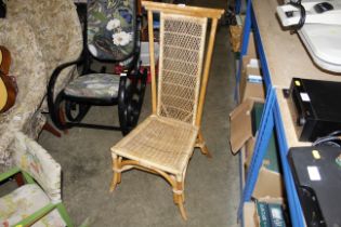 A bamboo and wicker high back chair