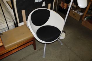 An IKEA 1990s Gubbo curved plastic chair