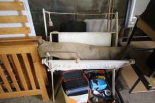 An army camp bed, wooden breakfast tray and a wood