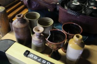 A quantity of various stoneware, glazed cups (one