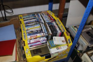 A box of miscellaneous DVDs etc.