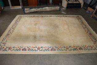 An approx. 12'11" x 9'8" wool rug