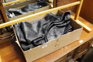 Four pairs of leather trousers